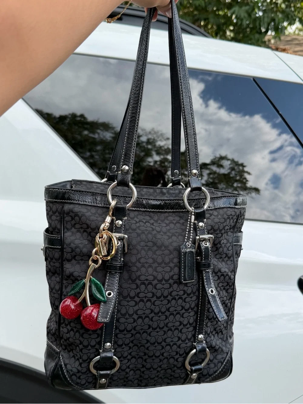 Coach Black Signature Canvas Shoulder Tote with Red Cherry Charm